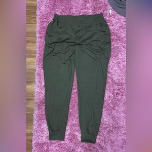 Green joggers, size L